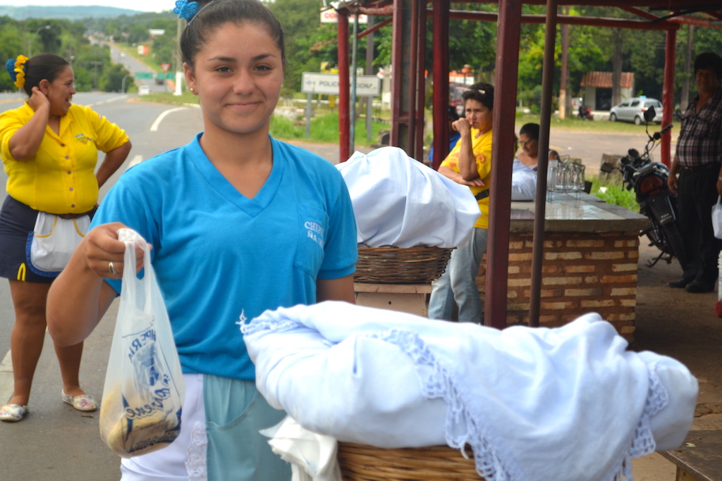 Woman selling chipa in Paraguay